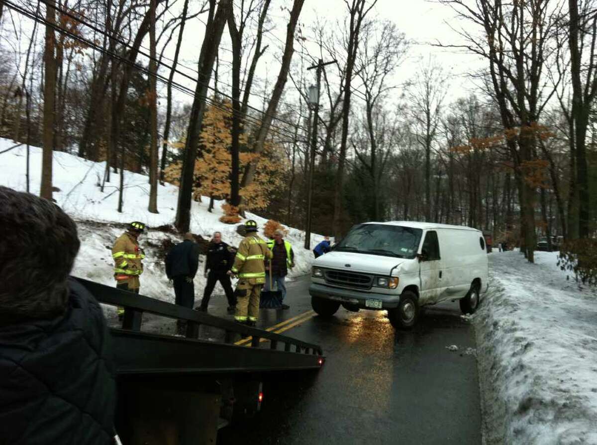 A New York man suffered minor injuries when his work van flipped over on Wahackme Road in New Canaan on Wednesday, Jan. 19, 2011 morning.