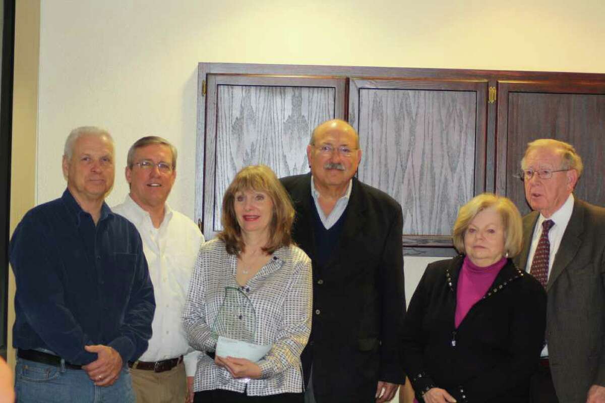 The Trinity-Glen Rose Groundwater Conservation District board formally presented Brad Groves' surviving family members with a scholarship in his memory during a Jan. 13 meeting. From left are board members Harris Dickey and David Anderson, Lauren Groves (widow of Brad Groves), board President Jorge Gonzales, and Brad’s parents Janie and Alvin Groves.Photo by Joni Simon