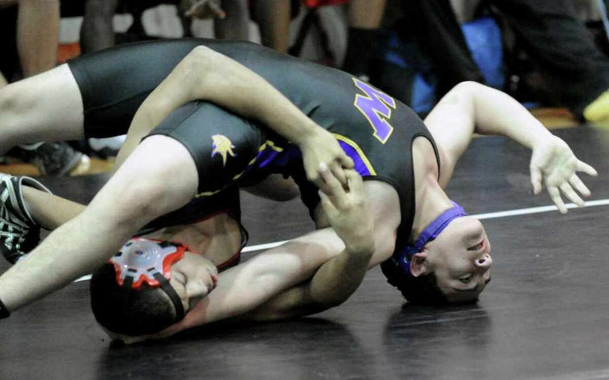 160 pound weight class, Ryan Whittle of Greenwich High School, left, takes on Carlos Alvarado of Westhill High School, right, during wrestling match between Greenwich High School and Westhill High School, at Greenwich High School, Wednesday afternoon, Jan. 19, 2011.
