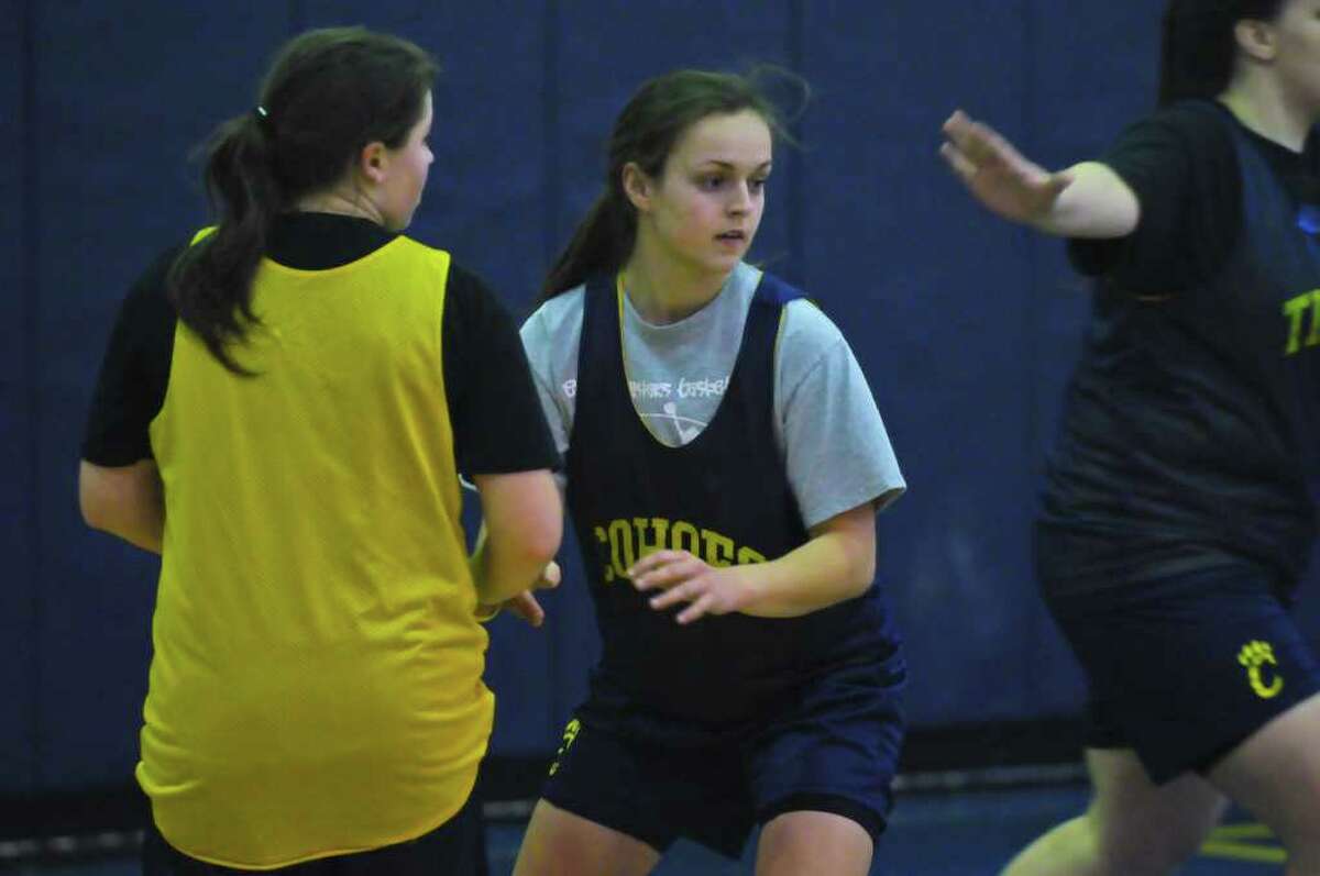 Cohoes' Bailei Tetrault, center, works on plays during practice. (Philip Kamrass / Times Union )