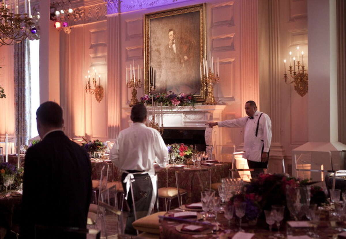 WASHINGTON - JANUARY 19: Staff prepare the State Dining Room of the White House for a state dinner 19, 2011 in Washington, DC. President Barack Obama and first lady Michelle Obama are hosting Chinese President Hu Jintao for a state dinner during his visit to the United States. (Photo by Brendan Smialowski/Getty Images)