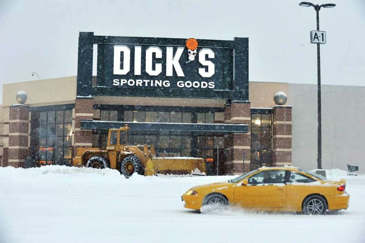 A plow clears the parking lot at the Danbury Fair mall, Friday, Jan. 21, 2010.