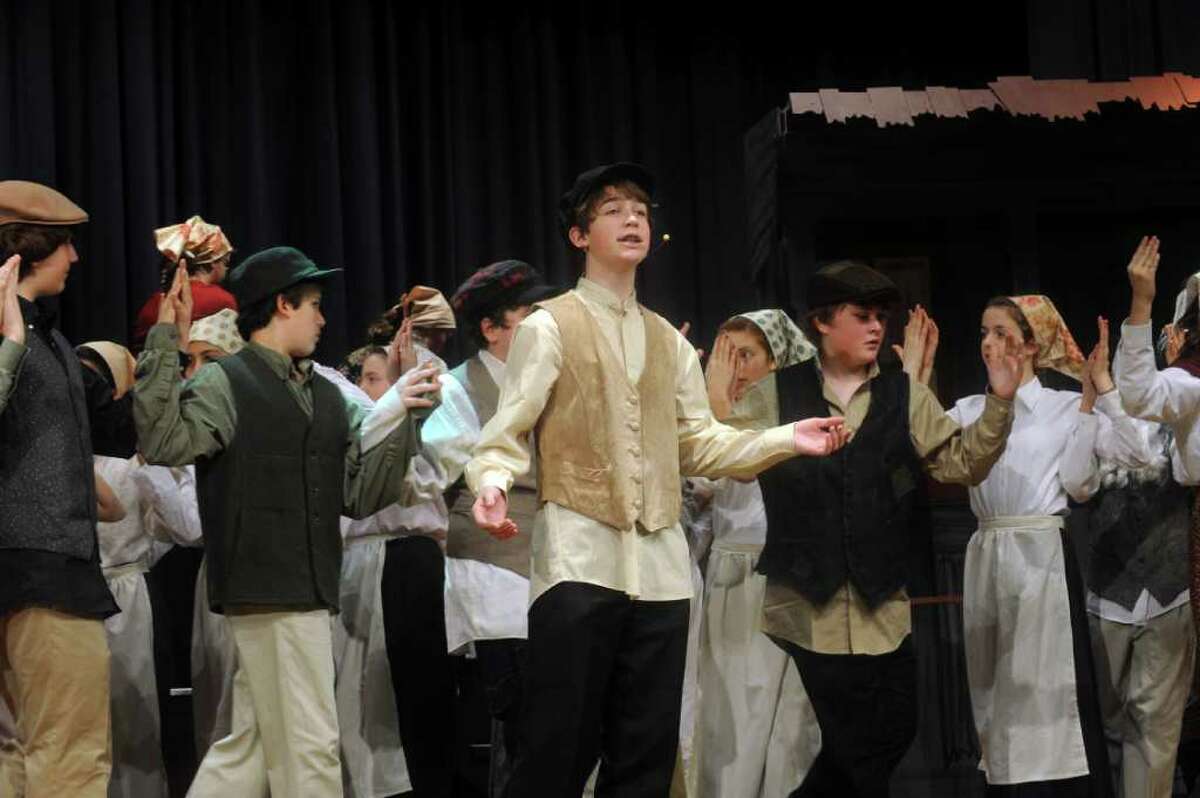 William Jones, playing Tevye, center,in a rehearsal of the Eastern Middle School eight-grade show chorus' production of "Fiddler on the Roof," on Monday, Jan. 24, 2011. The Eastern Middle School eighth-grade show chorus will perform the musical “Fiddler on the Roof” from Jan. 27-29 in the school’s Lee Book Auditorium, 51 Hendrie Ave. Show times are 4 p.m. Jan. 27, 7:30 p.m. Jan. 28 and 7:30 p.m. Jan. 29. Tickets for the Jan. 27 show are $5, and the following two shows are $10. Tickets are on sale in the main lobby of the school every day before school from 7:15 to 7:45 a.m. and after school from 2:45 4 p.m. Ticket reservations can also be made over the phone by calling the school office at 203-637-1744.