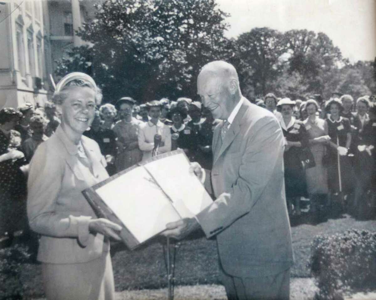 Percy Maxim Lee, Percy Lee Landstaff's mother, and active League of Women Voters member, stands with President Dwight D. Eisenhower, in this undated photograph.