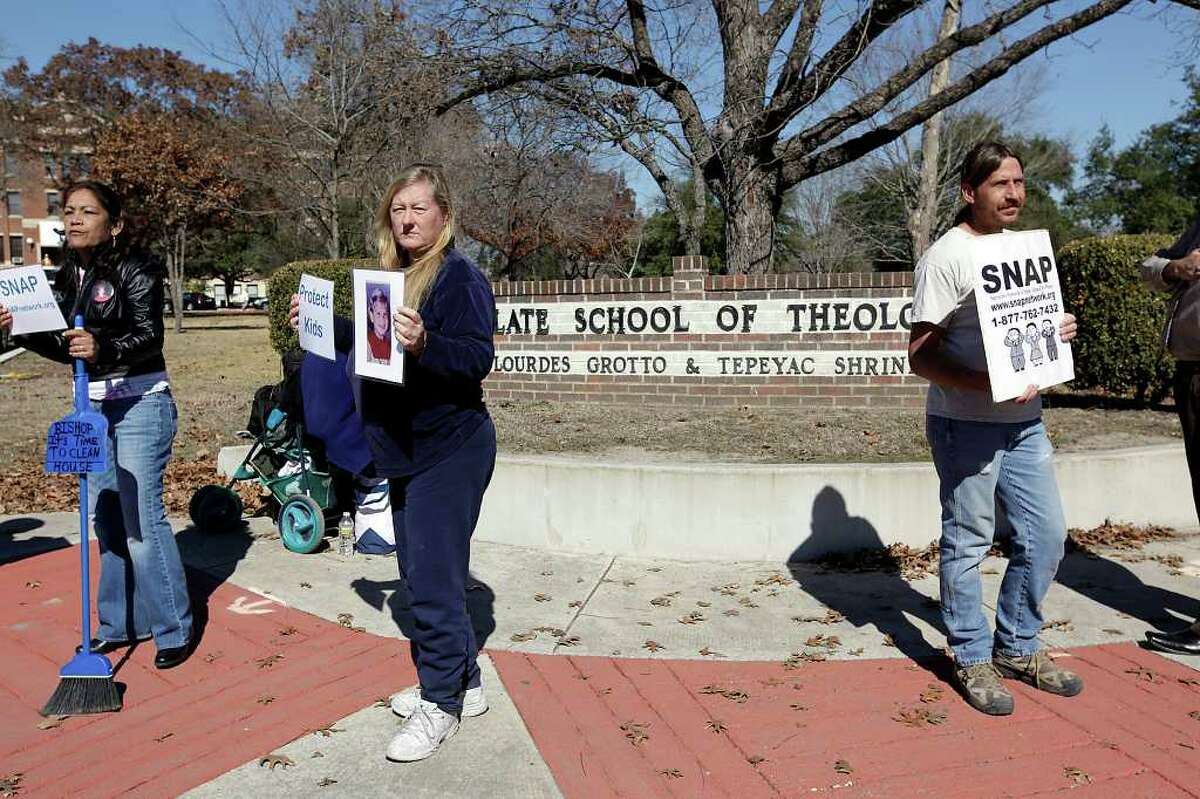Three members of the Survivors Network of those Abused by Priest, (SNAP), protest in front of the Oblate School of Theology, Wednesday, Jan. 26, 2011. They were protesting the school's library director, Father Donald J. Joyce. He is accused of sexually molesting a boy in Massachusetts in the late 1970's. Protesting from left are, Barbara Garcia-Boehland, Cindy Roblain and Matthias Boehland. JERRY LARA/glara@express-n­ews.net