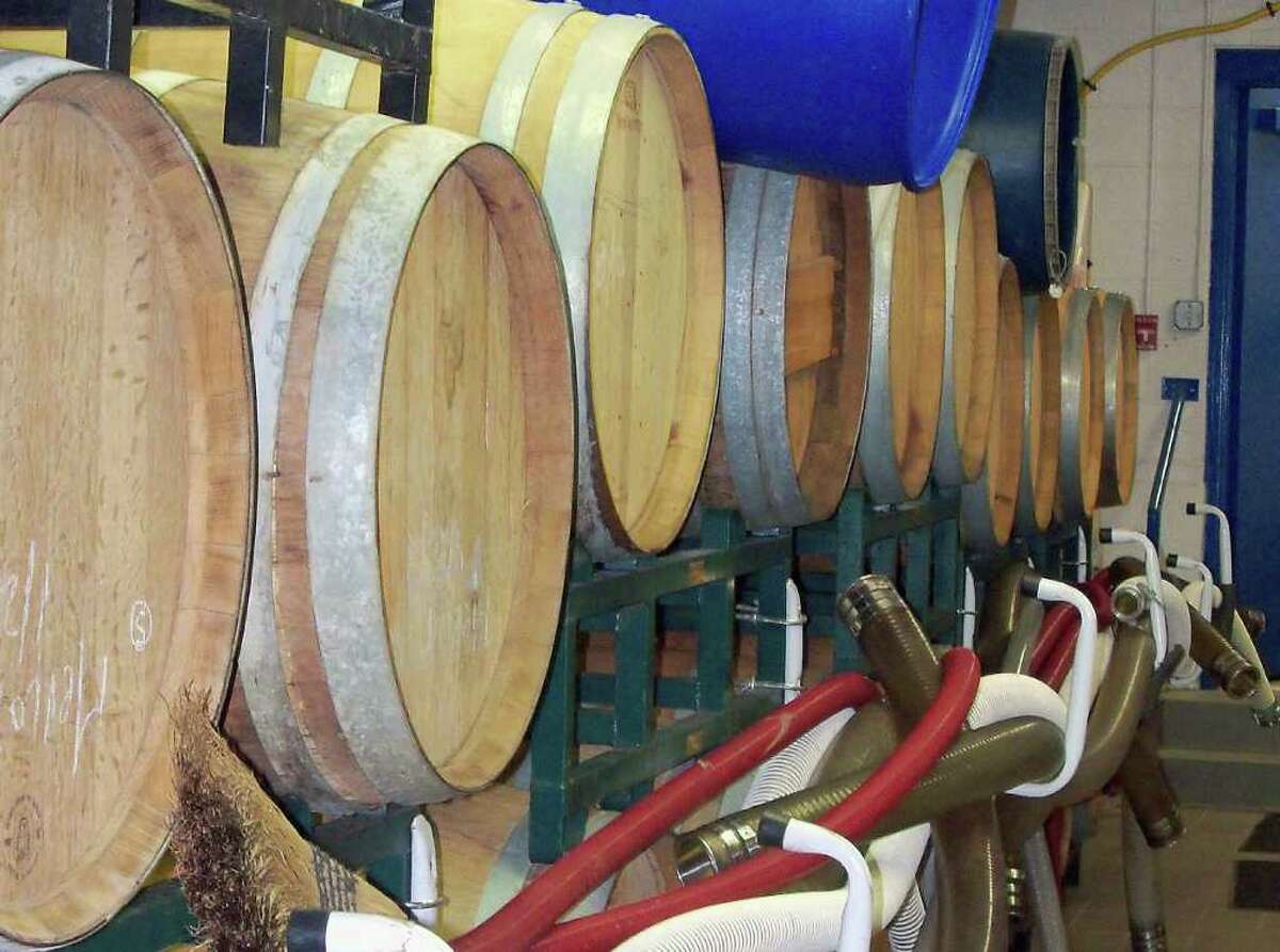 Both red and white wine is stored in oak barrels at Black Rock Vintners. The winery is owned by Fairfield resident Tony Izzo and the young company's products have already won awards.