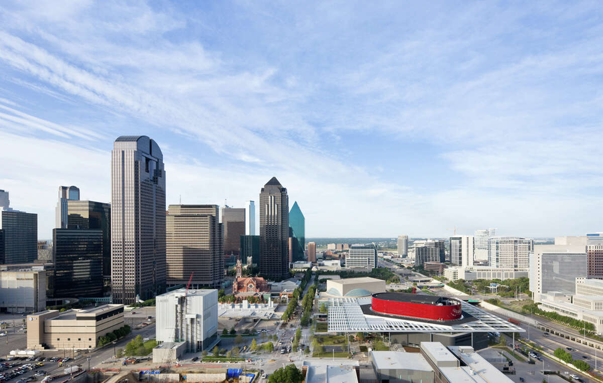 An aerial view of the Dallas Arts District includes the AT&T Performing Arts Center. The red swoosh of a building is the Winspear Opera House within the center. COURTESY IWAN BAAN