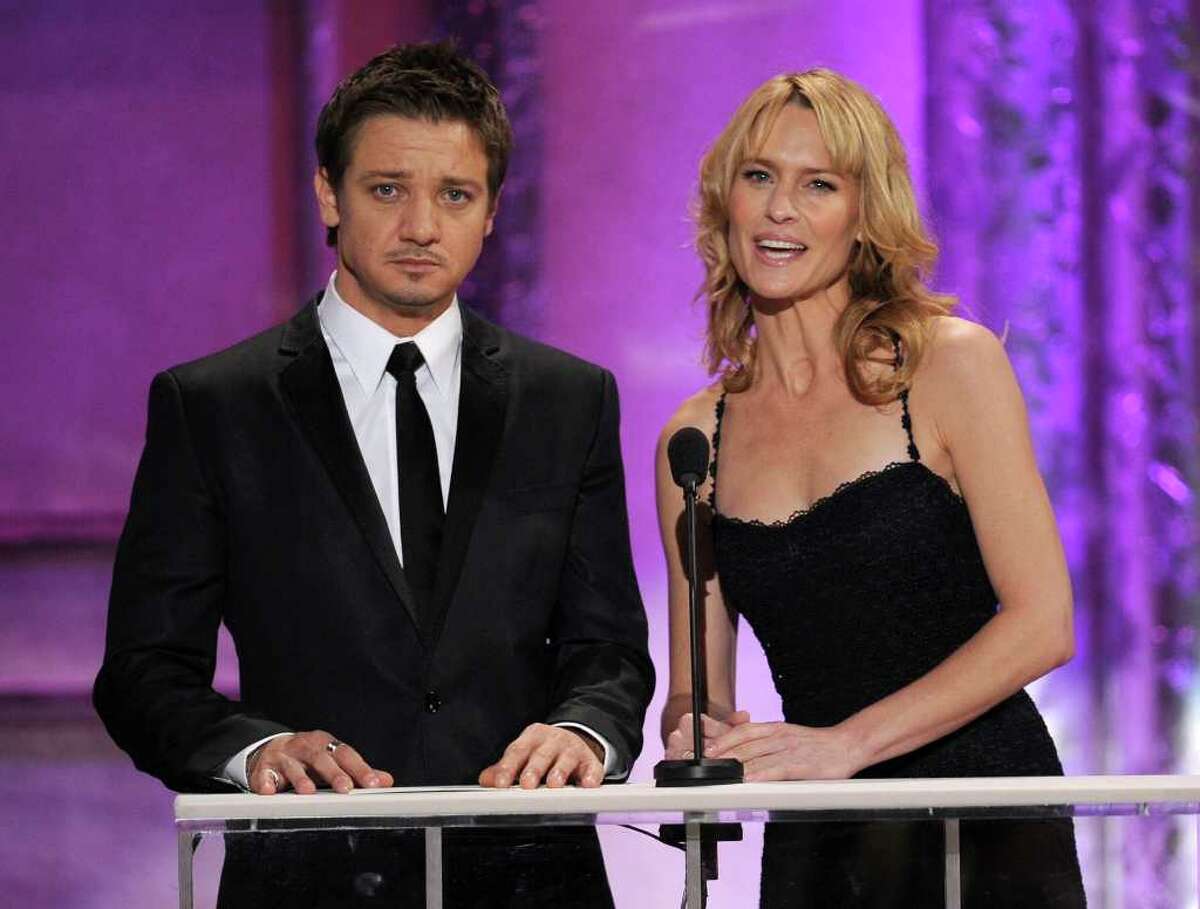 LOS ANGELES, CA - JANUARY 30: Actors Jeremy Renner (L) and Robin Wright speak onstage during the 17th Annual Screen Actors Guild Awards held at The Shrine Auditorium on January 30, 2011 in Los Angeles, California. (Photo by Kevin Winter/Getty Images) *** Local Caption *** Jeremy Renner;Robin Wright