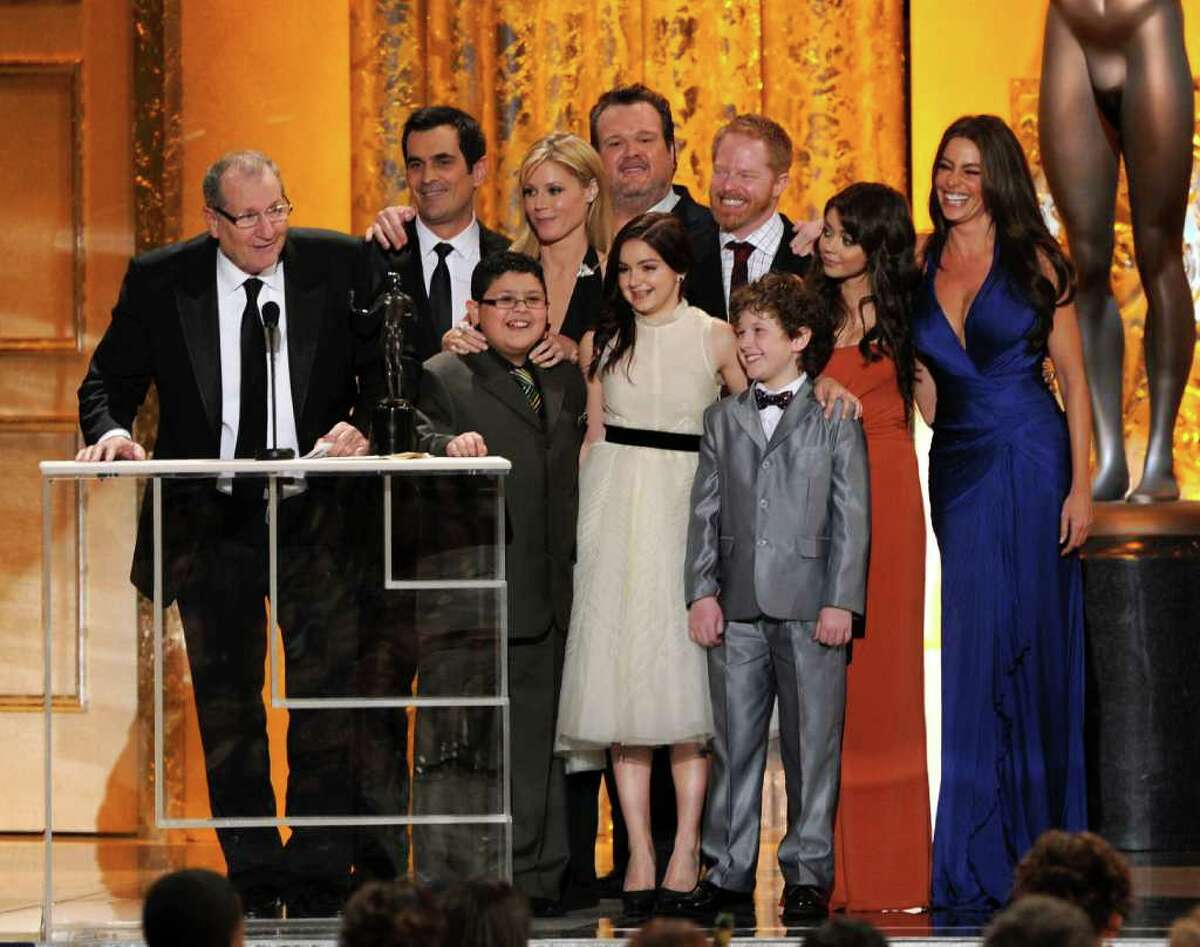 LOS ANGELES, CA - JANUARY 30: Cast of "Modern Family," winners of Outstanding Performance by an Ensemble in a Comedy Series award, speak onstage during the 17th Annual Screen Actors Guild Awards held at The Shrine Auditorium on January 30, 2011 in Los Angeles, California. (Photo by Kevin Winter/Getty Images) *** Local Caption *** Sofia Vergara;Jesse Tyler Ferguson;Julie Bowen