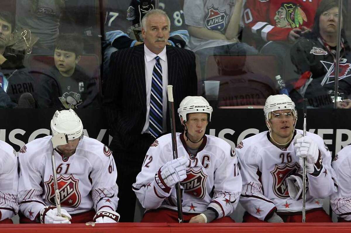 RALEIGH, NC - JANUARY 30: Head coach Joel Quenneville stands above Rick Nash #61 of the Columbus Blue Jackets, Eric Staal #12 of the Carolina Hurricanes, Paul Stastny #26 of the Colorado Avalanche and coach Joel Quenneville of Team Staal***coach Mike Haviland of Team Staal of Team Staal in the 58th NHL All-Star Game at RBC Center on January 30, 2011 in Raleigh, North Carolina. (Photo by Bruce Bennett/Getty Images) *** Local Caption *** Joel Quenneville
