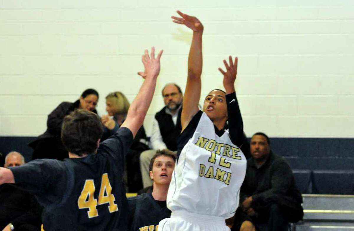 Notre Dame Fairfield's Trey McPherson (12) shoots over Weston's Lyle Mitchell (44) during the boys basketball game at Notre Dame on Friday, Jan. 28, 2011.