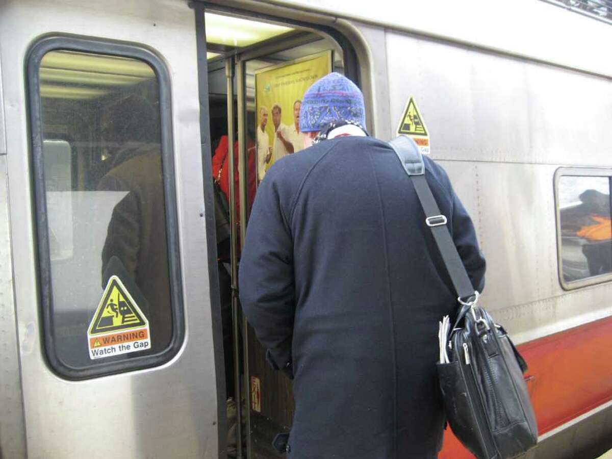 Greenwich commuters board a New York-bound train on the morning of Jan. 31, 2011. The harsh winter weather has left rail riders facing crowded cars and delays throughout January. Photo by Lisa Chamoff/staff