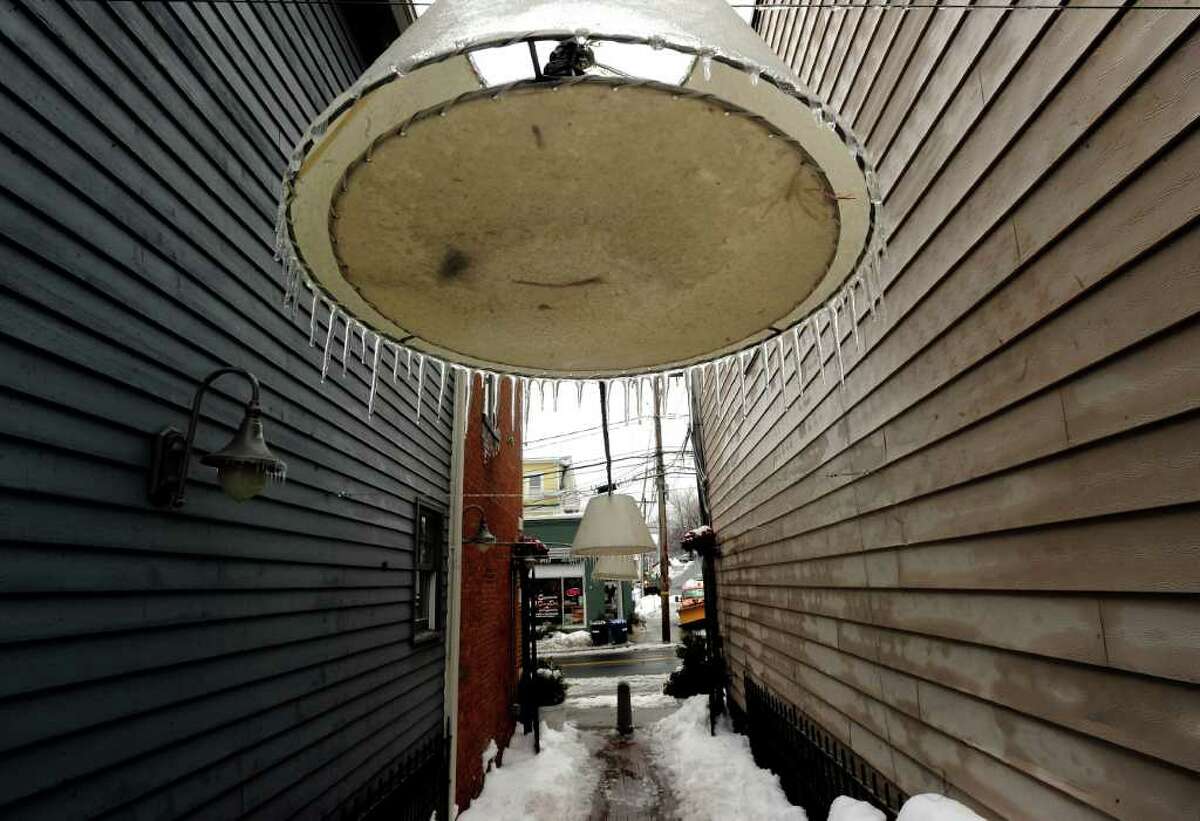 Ice on a light shade in an alleyway off Mill Street, Byram, during the aftermath of ice storm that hit the Greenwich area, Wednesday afternoon, Feb. 2, 2011.
