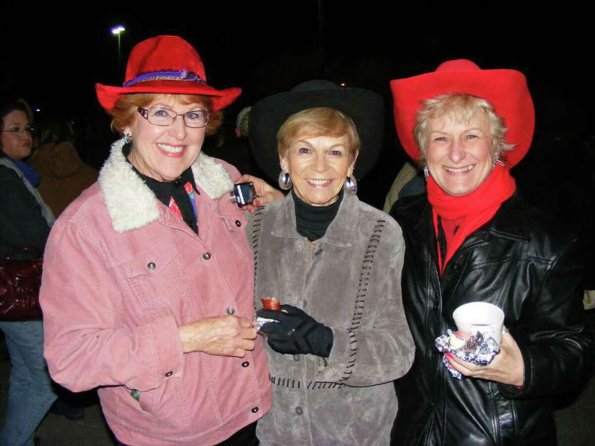 Enjoying their early morning tacos, sausage wraps and coffee Friday are friends (from left) Linda Gorham , Bonnie Tullgren and Mary Cottrell, among the estimated 40,000 attendees to the 33rd annual Cowboy Breakfast.
