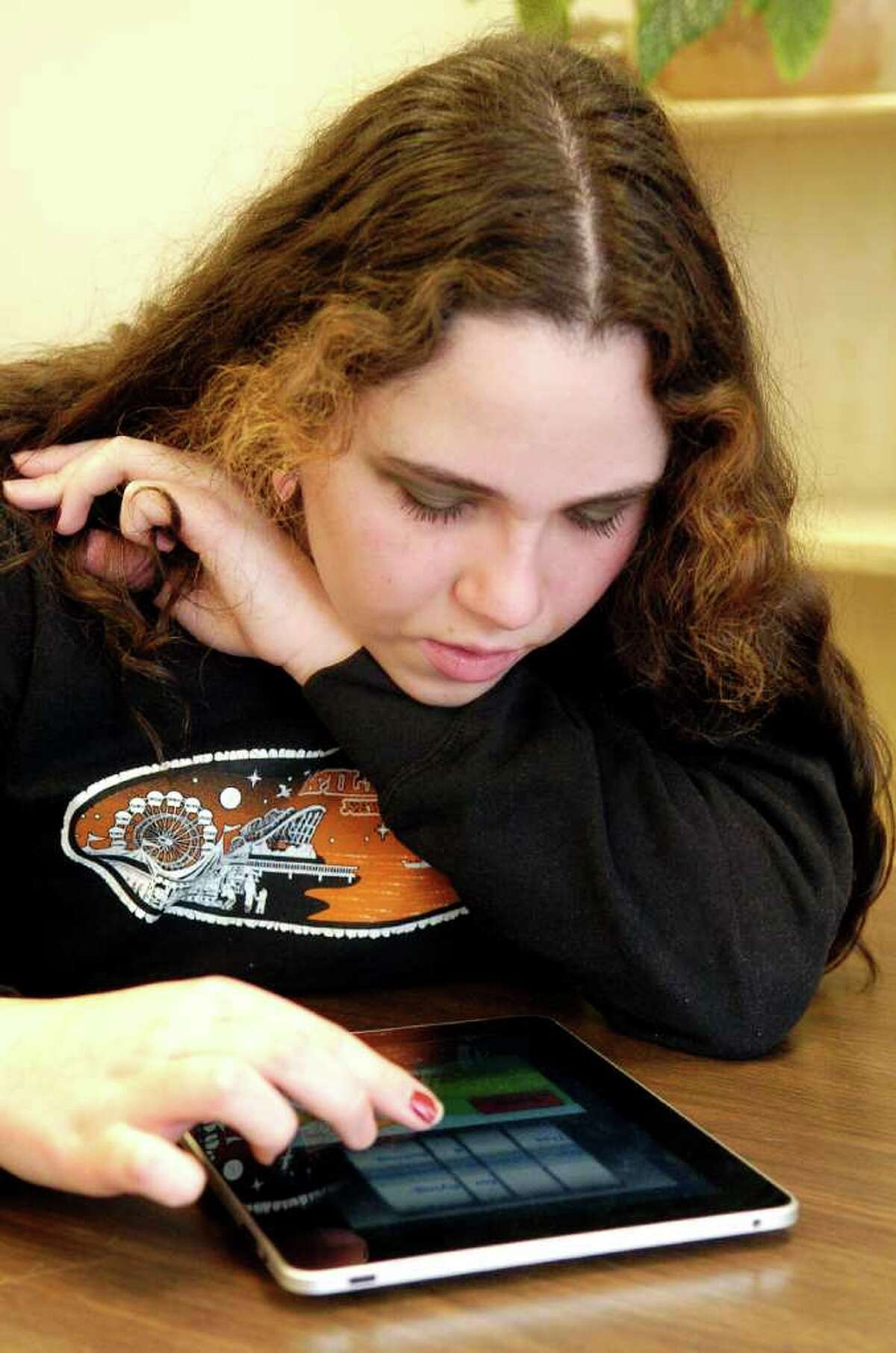 Oliva Shea, a students in Stamford (Conn.) High School's autism spectrum disorder classroom, uses a iPad to help with her learning during math time on Thursday February 3, 2011.