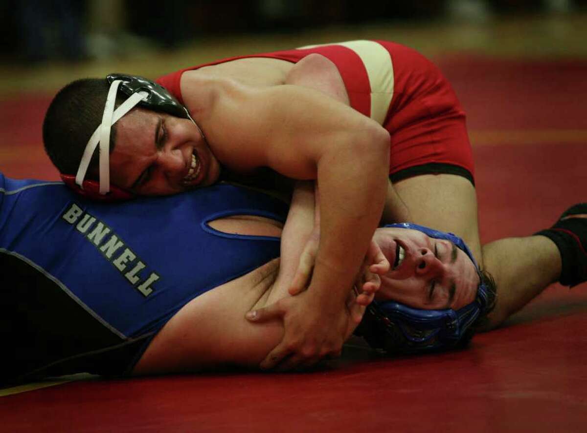 Stratford's Brian Santiago, top, looks to pin Bunnell's Jon Iseppi in the 160 pound match at Stratford High School on Monday, February 7, 2011.