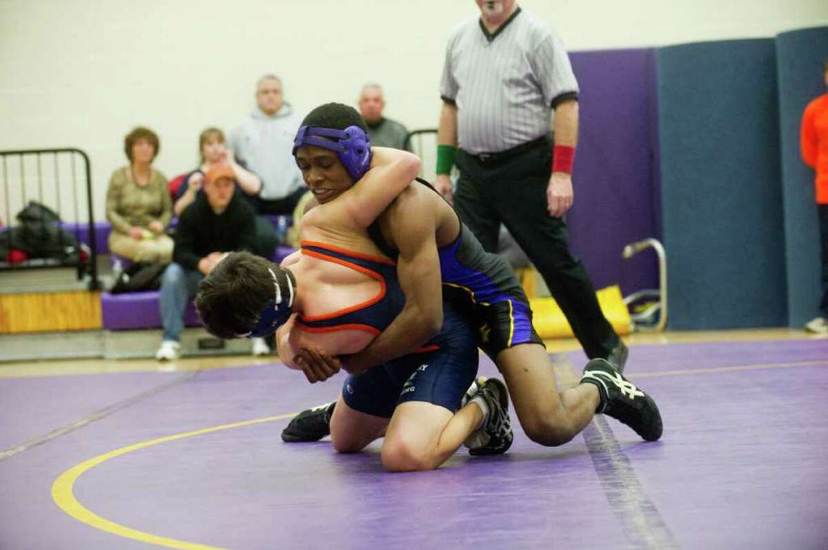 Westhill's Armani Meandesir wrestles Danbury's Anthony Cote in the 135 pound division as Westhill High School hosts Danbury High in a boys wrestling match in Stamford, Conn., February 7, 2011. Meandesir won the division.
