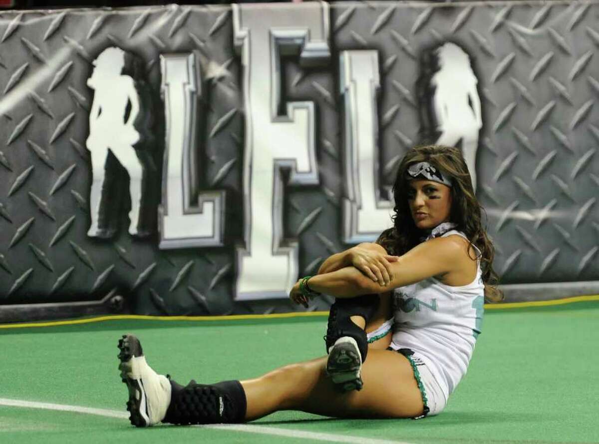 LAS VEGAS, NV - FEBRUARY 06: Donna Ferry #18 of the Philadelphia Passion warms up before playing the Los Angeles Temptation in the Lingerie Football League's Lingerie Bowl VIII at the Thomas & Mack Center February 6, 2011 in Las Vegas, Nevada. Los Angeles won 26-25. (Photo by Ethan Miller/Getty Images) *** Local Caption *** Donna Ferry