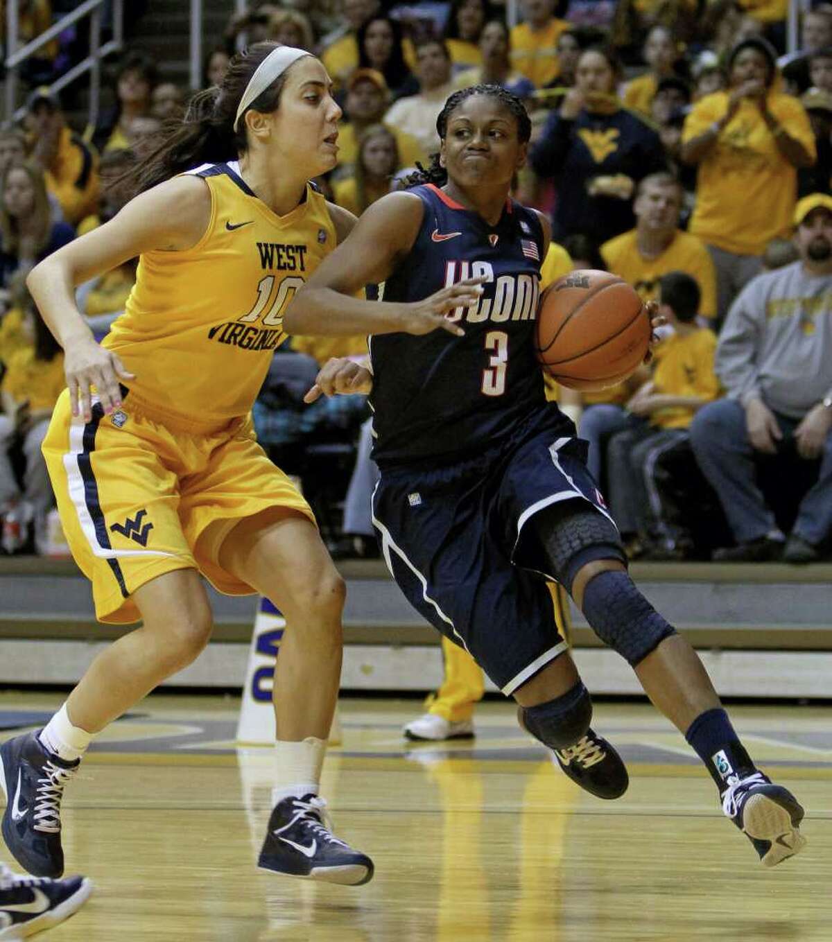 UConn women hurt by foul trouble but hang on to beat W.Va.