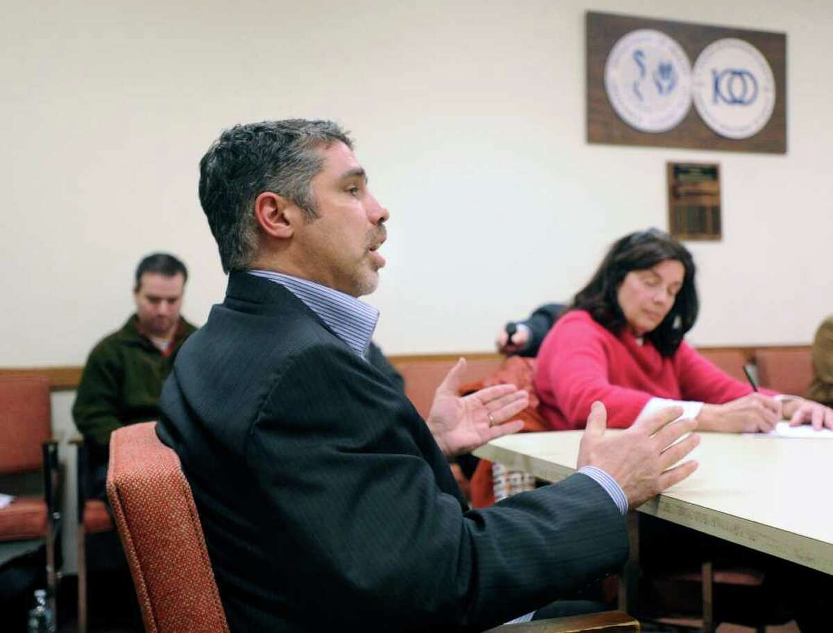 Old Greenwich resident Gary Dell’Abate, who is better known by the moniker Baba Booey as the producer of “The Howard Stern Show,” speaking to the Representative Town Meeting’s Appointments Committee at Greenwich Town Hall, Feb. 8, 2011. Dell’Abate was previously nominated for a seat on the town’s Board of Parks and Recreation. At right, taking notes, is Coline Jenkins of Old Greenwich, an appointments committee member.