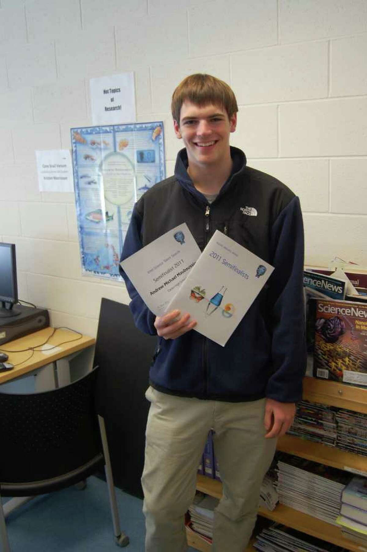 Andrew Mauboussin poses with his award for being a semi-finalist in the Intel Science Talent Search competition.