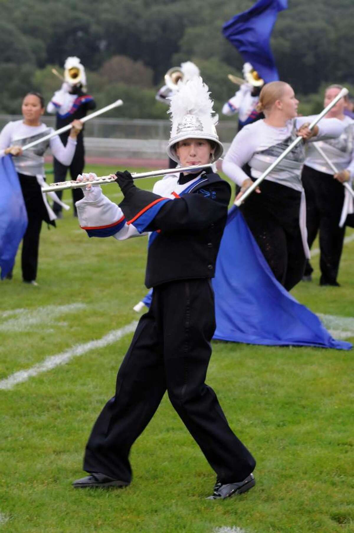 The Danbury High School Mad Hatter's Marching Band performs at the Bethel High School Wildcat Marching Band and Color Guard band competition "The Quest for the Best" on Friday evening Sept. 12, 2009. One of the bands flute players, Sheila Kennedy, stays focused on the performance.
