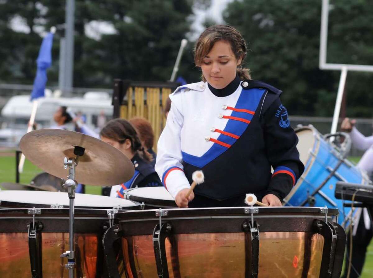 The Danbury High School Mad Hatter's Marching Band performs at the Bethel High School Wildcat Marching Band and Color Guard band competition "The Quest for the Best" on Friday evening Sept. 12, 2009. Breana Vanak plays the Tympani drum in the bands pit.