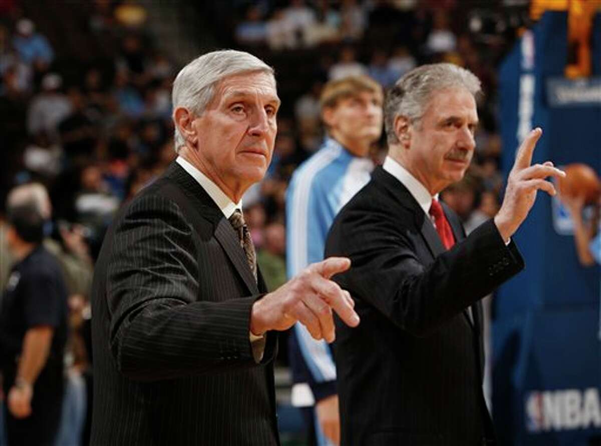 Utah Jazz head coach Jerry Sloan (front) and assistant coach Phil Johnson both resigned Thursday.