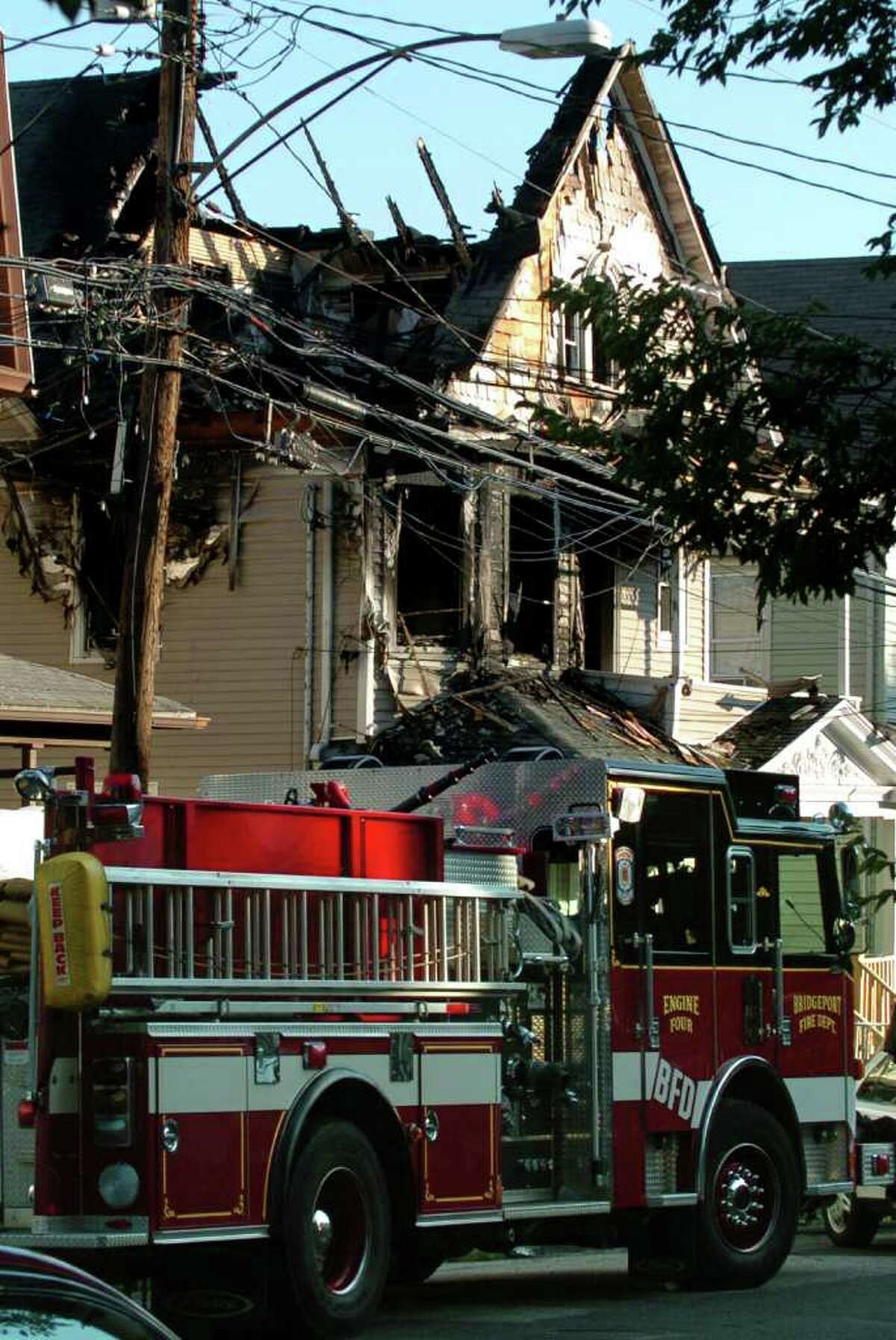The scene at 41 Elmwood Ave. in Bridgeport, Conn. on July 24, 2010. Bridgeport Fire Department Lt. Steven Velasquez and firefighter Michel Baik were killed fighting a fire in the home that day.