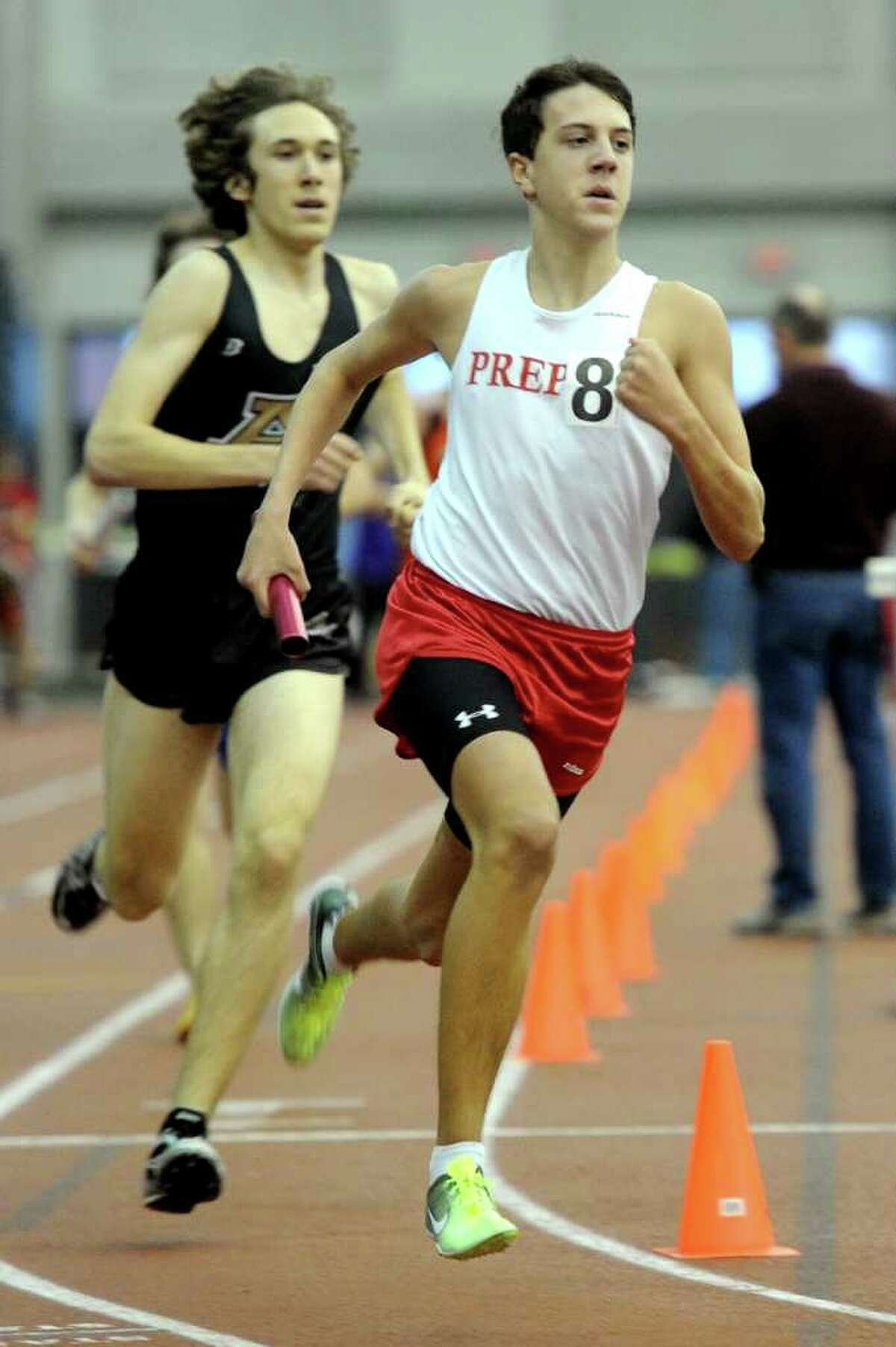Fairfield Prep's Patrick Corona runs in the 4x800 relay during Saturday's Class LL track championship meet at the New Haven Athletic Center on February 12, 2011.