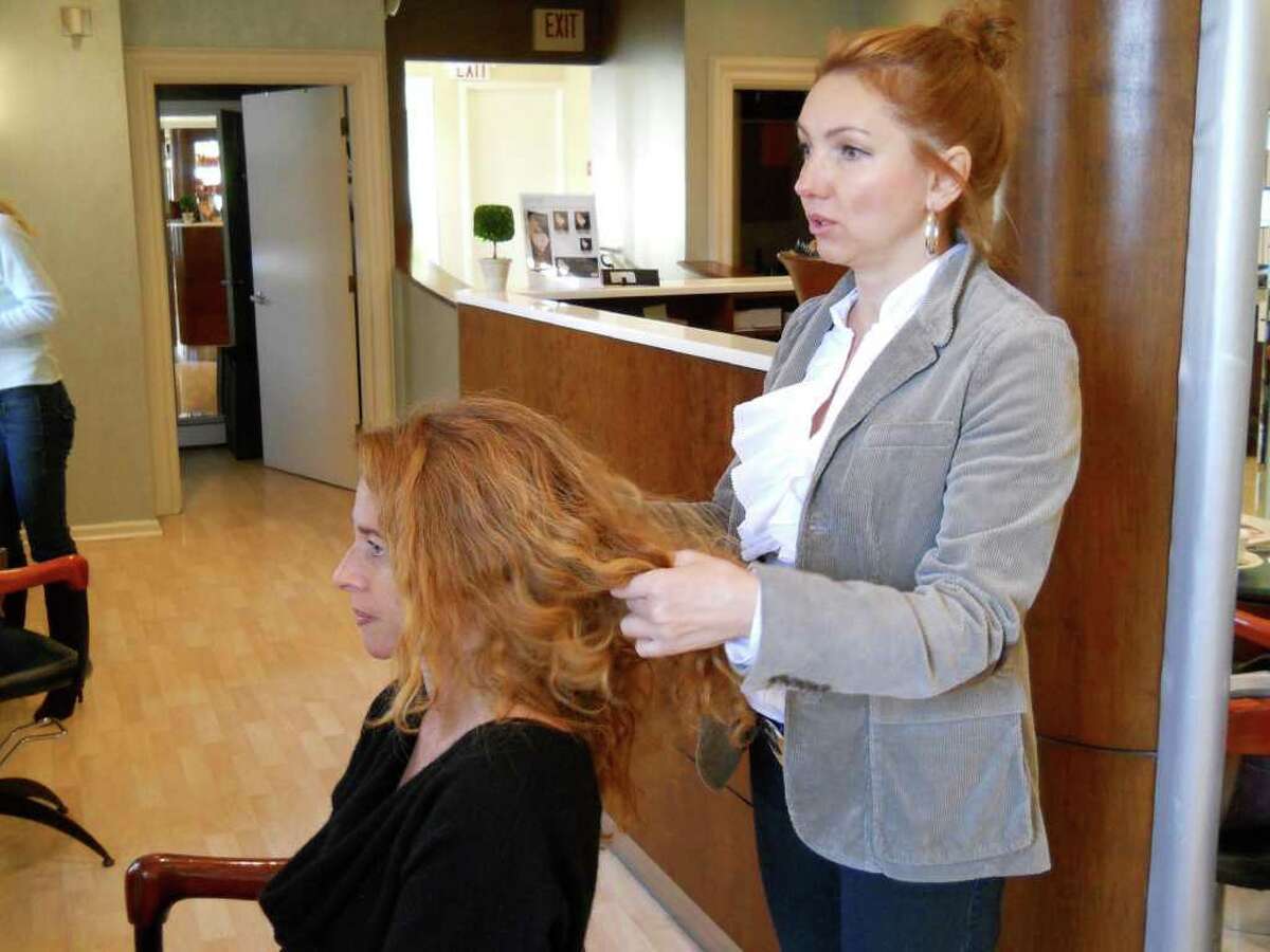 Ewa Marcinczyk, a senior stylist at Giancarlo De Beradinis salon in downtown Greenwich, takes a look at HealthyLife cover model Carol Shwidock's hair and creates a plan of action for styling.