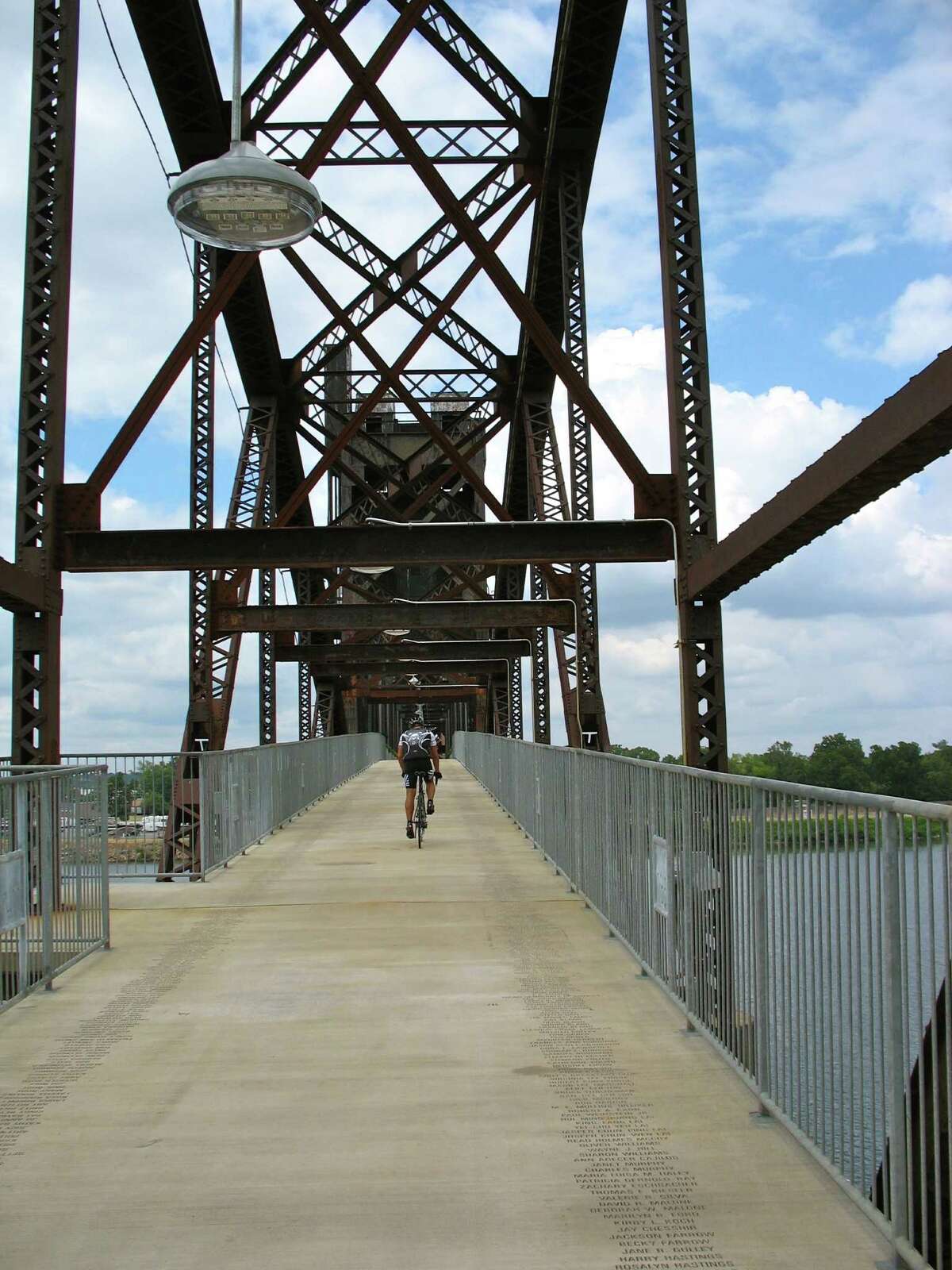 An old railroad bridge crossing the Arkansas River near the Clinton Presidential Library in Little Rock was converted to a bridge for walkers, joggers and bicyclists. It's one of four that are part of of the 17-mile River Trail.