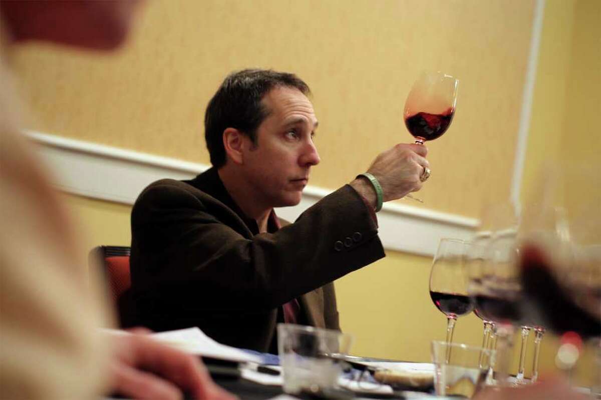 Judge Solomon Paley studies a pinot noir during the KLRN San Antonio Wine Competition judging at La Quinta Inn, Saturday, January 29, 2011.