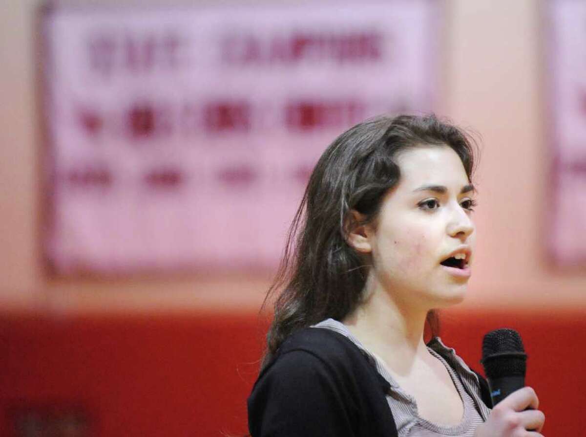 Greenwich High School sophomore Rachel Rossello, 15, sings the National Anthem before the start of the Greenwich High School girls varsity basketball game against Trinity Catholic of Stamford, at Greenwich High School, Wednesday night, Feb. 16, 2011.