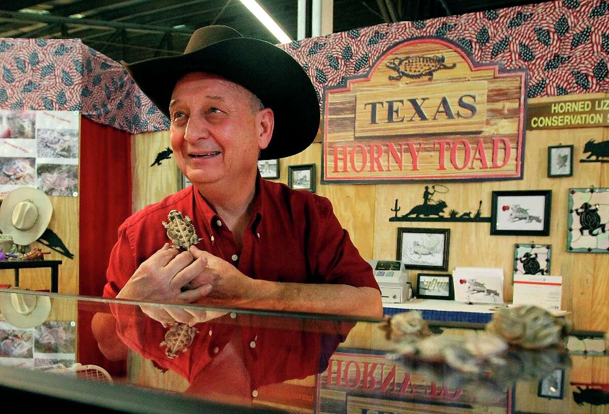 Vendor and artisan Tom McCain of Horny Toad Connection, Inc. shows one of his many sculpted horned lizards at this booth in the Texas Star Marketplace at the San Antonio Stock Show and Rodeo.