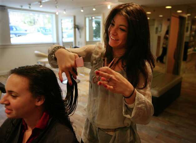 Hair Stylist Ayrica Gelinas Of Woodbury Gives A Haircut To