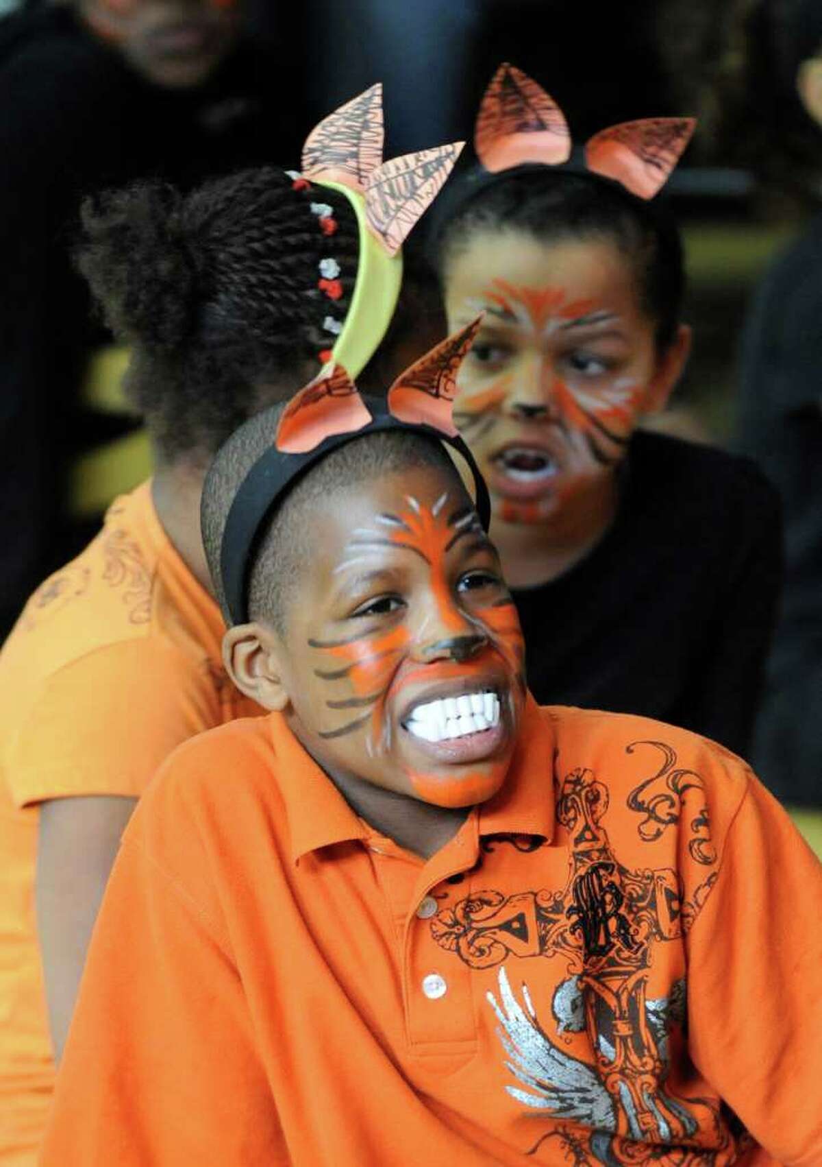Tyler Caldwell shows off his "tiger" teeth as he joined other third graders from Troy School 2 during a performance of native dance of Nigeria February 16, 2011, as part of a program that studied the customs of the country in dance, storytelling and art under the supervision of The Arts Center of the Capital Region with a grant from First Niagara Bank. (Skip Dickstein / Times Union)