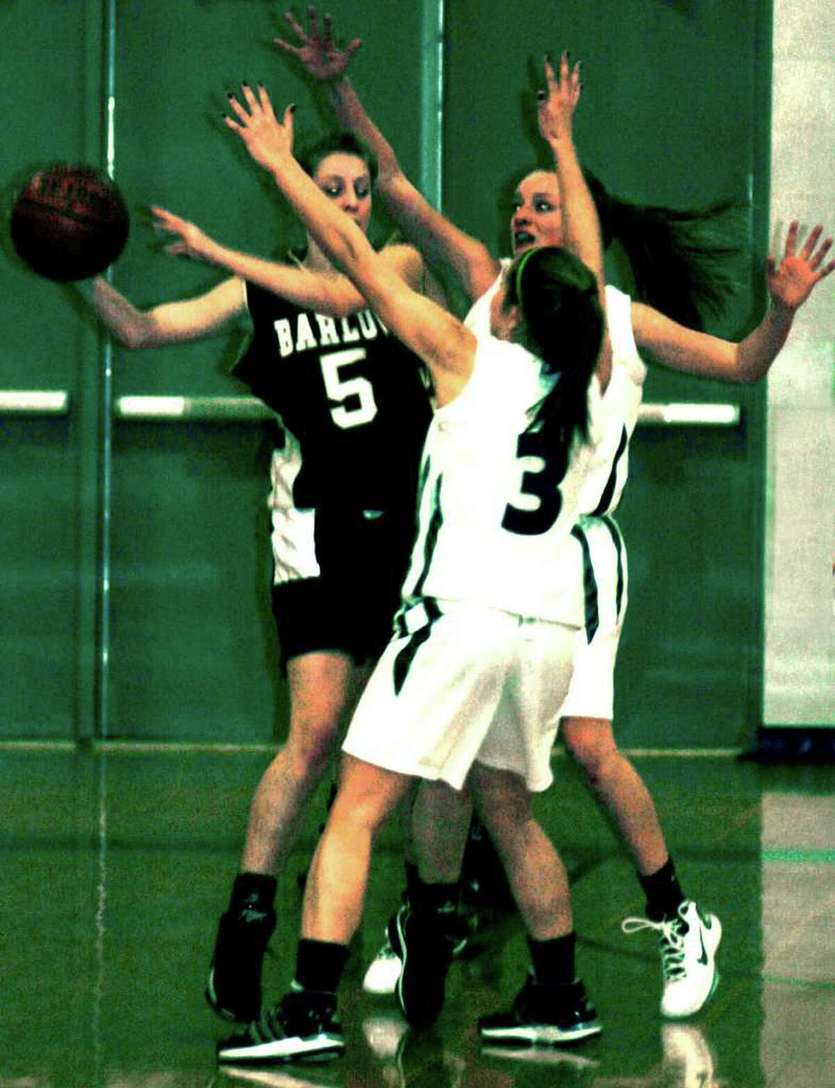 SPECTRUM/#3 Kelsey Heaton and #14 Jessica Noteware play defense for New Milford High School girls' basketball vs. Joel Barlow, Feb. 11, 2011 at NMHS.