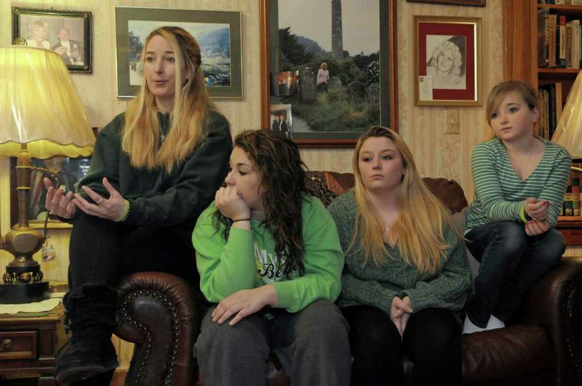 Patricia Burns, far left, talks about her daughter Christalin Canavan, who died suddenly and inexplicably on Dec. 27. Seated at Christalin's grandparents home in Colonie are Burns, Christalin's best friend Acacia Rolon, 15, and two of Canavan's sisters, Megan Jenkins, 19, and Autumn Burns, 11. (Paul Buckowski / Times Union)
