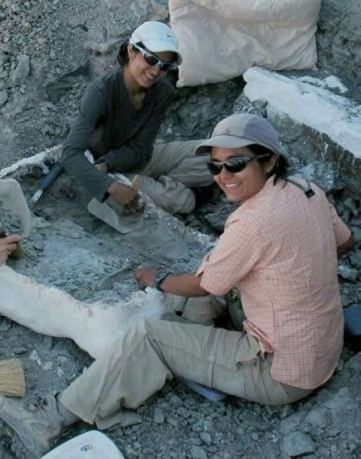 Celina (left) and Marina Suarez at the site of the dinosaur boneyard they discovered in Utah, where a new dinosaur species named after them, Geminiraptor suarezarum, was found. Courtesy photo.