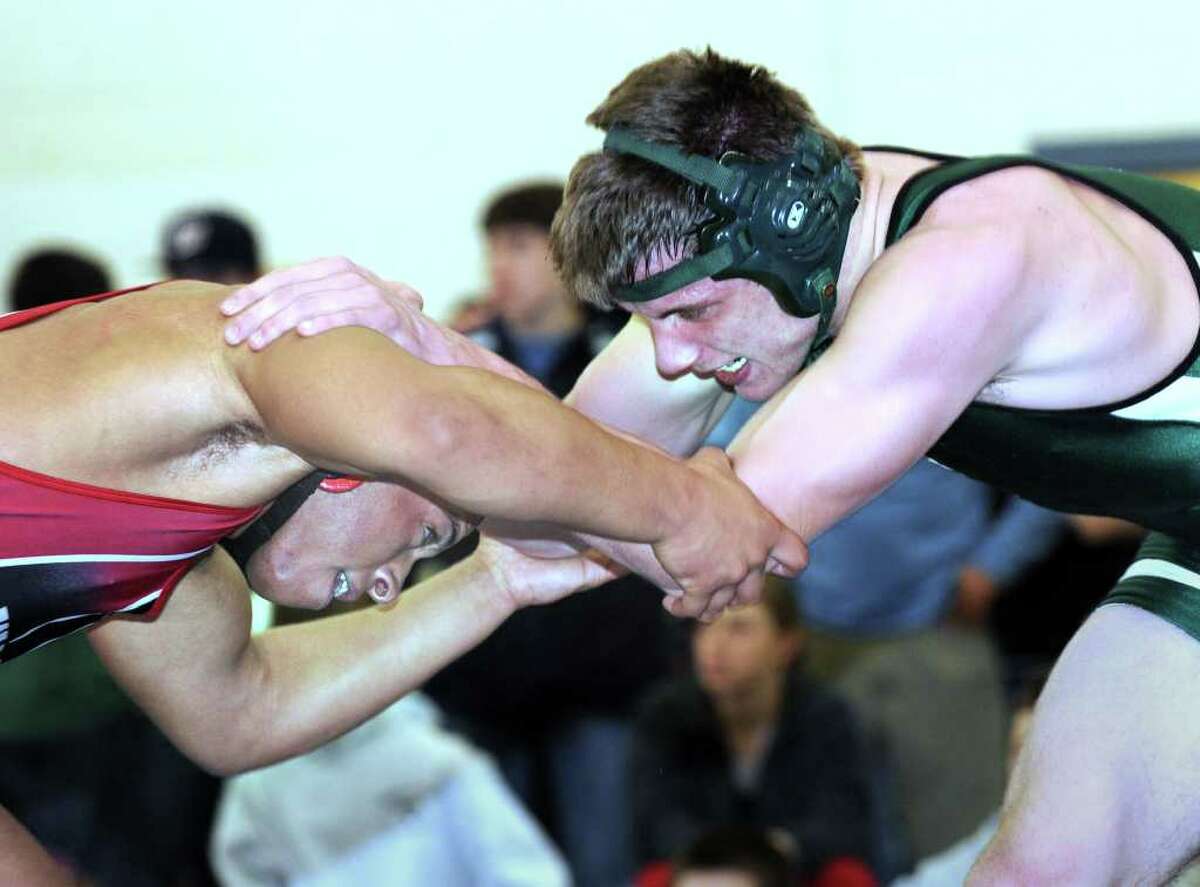 Avon wrestling claims Class M crown; Killingly wins Class S title