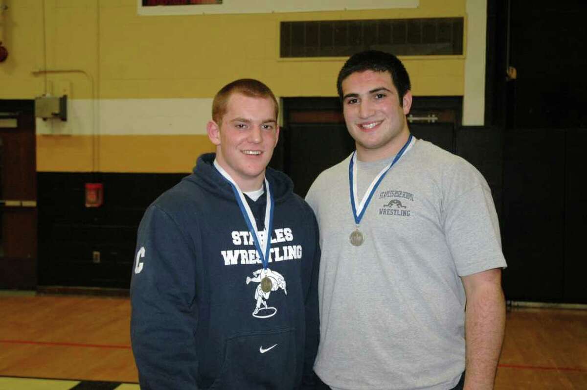 Staples senior quad-captains Chris Giunta and Julian Gendels display their silver medals with pride after placing second in the 215-pound and heavyweight weight classes, respectively in the Class LL wrestling championships. Giunta and Gendels led the Wreckers to 14th place overall with 68.5 points.