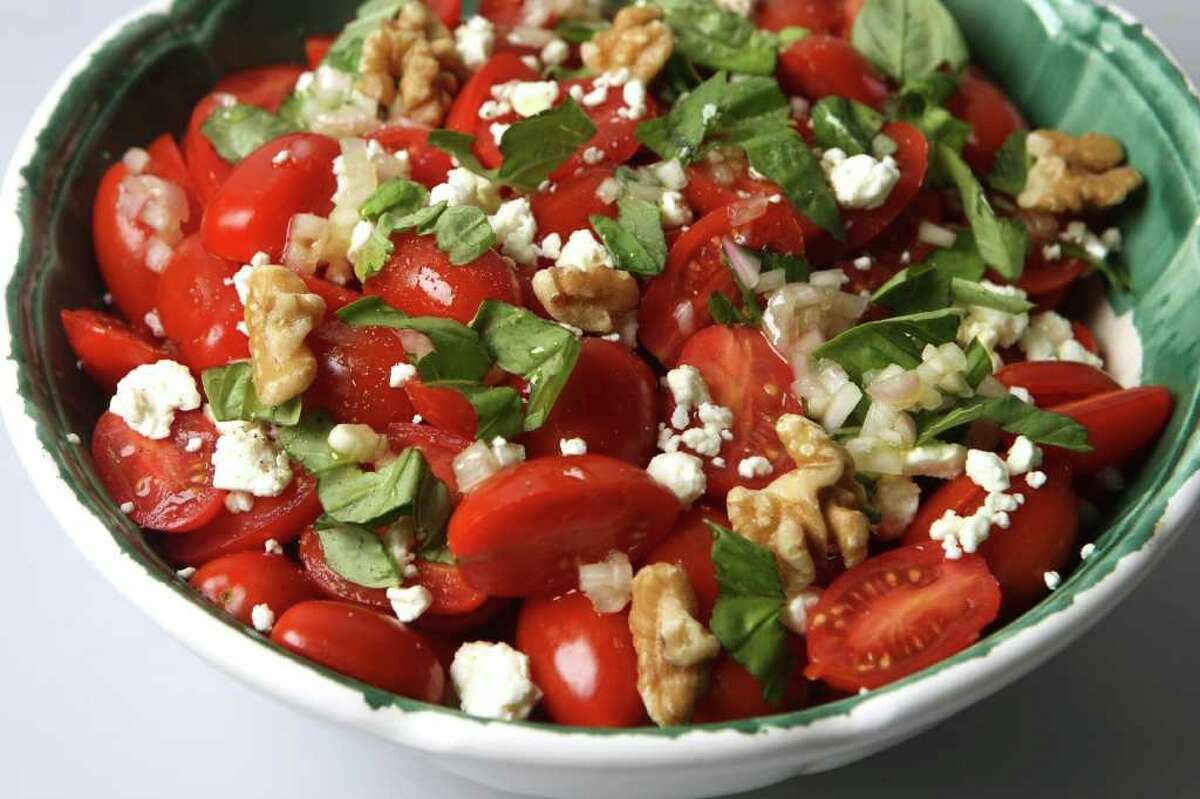 The recipe for the colorful Cherry Tomato and Feta Salad with walnuts and basil was submitted by Julie Bray Patterson.