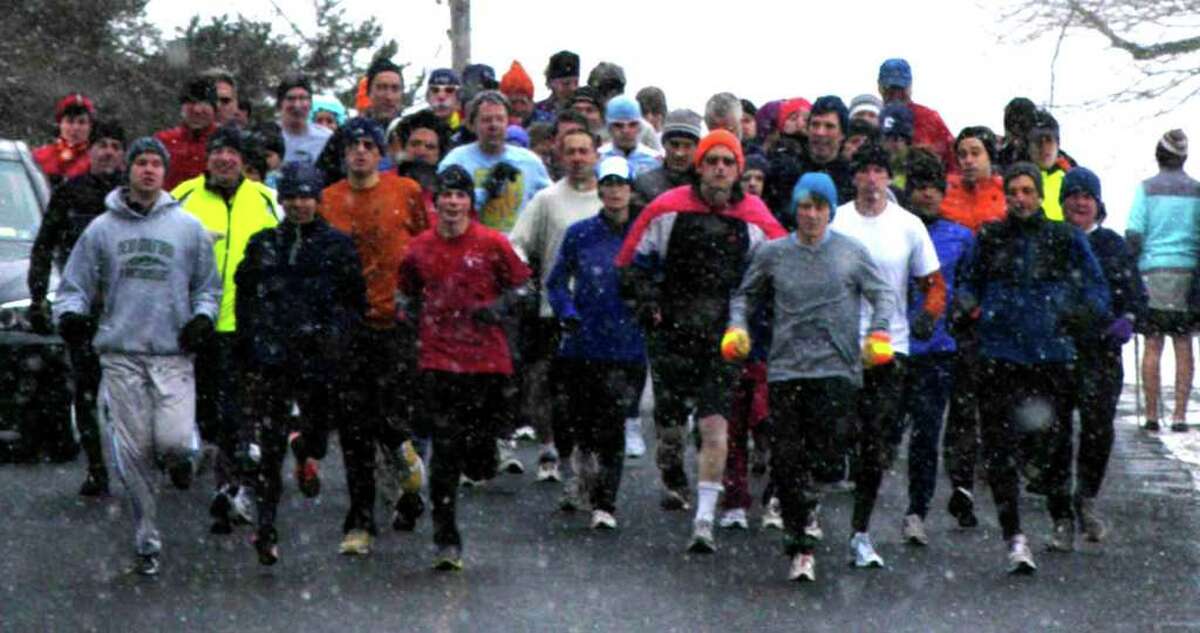 SPECTRUM/An intrepid field takes off amidst a snow squall from the starting line along West Apple Lane for the season opener of the Roxbury road race series, Feb. 19, 2011
