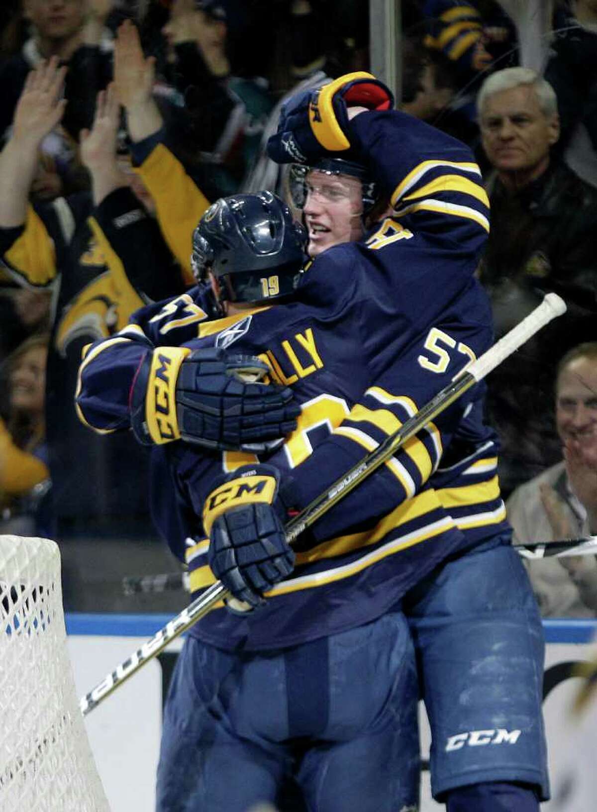 Buffalo Sabres' Tyler Myers (57) celebrates his goal with Tim Connolly (19) against the Atlanta Thrashers during the first period of an NHL hockey game in Buffalo, N.Y., Wednesday, Feb. 23, 2011. (AP Photo/David Duprey)