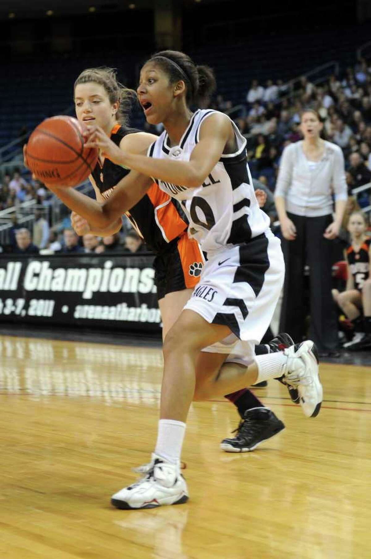 Trumbull's Mookie Kennedy dribbles during Thursday's FCIAC girls basketball championship game at Webster Bank Arena at Harbor Yard on February 24, 2011.