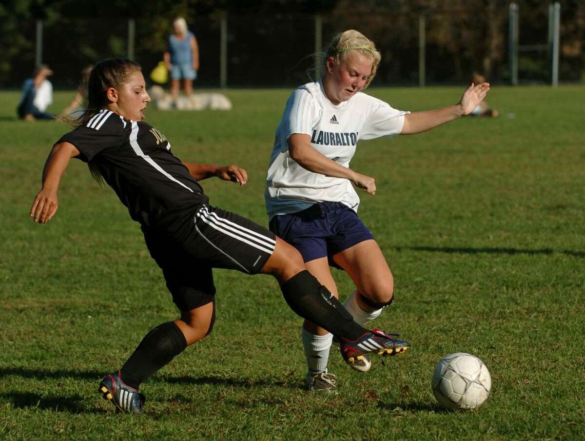Barlow's #4 MacKenzie Cohane, left, tries to cut off Lauralton Hall's #4 Allison Miles, as she chases down the ball, during game action in Milford, Conn. on Tuesday Sept. 15, 2009.