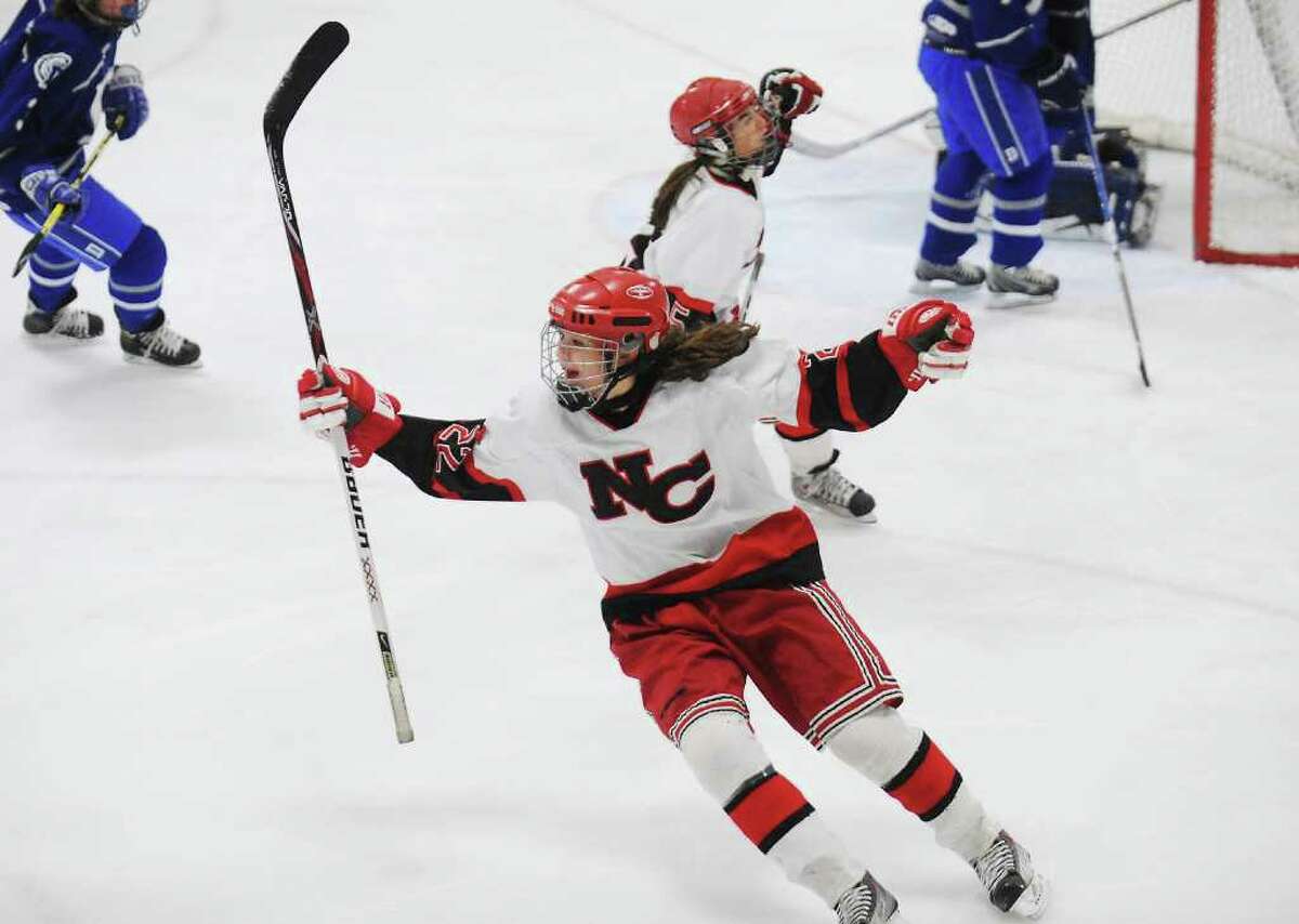New Canaan High School's Olivia Hompe celebrates after scoring against Darien High School in the girls hockey FCIAC championship game at Terry Conners Rink in Stamford, Conn. on Saturday February 26, 2011. New Canaan won 7-1.