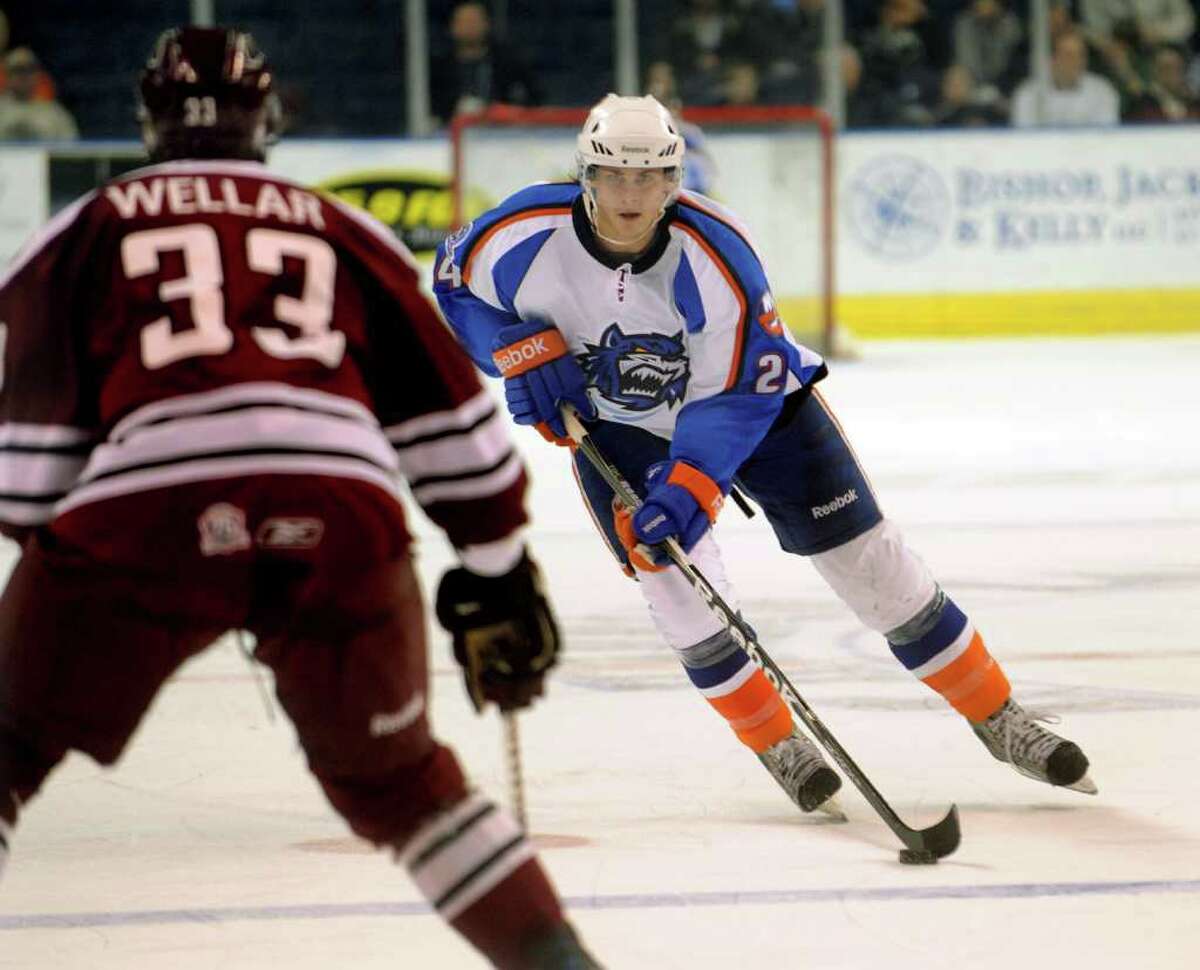 Sound Tigers #24 David Ulstrom drives the puck towards Hershey's #33 Patrick Wellar, during hockey action at the Webster Bank Arena in Bridgeport, Conn. on Sunday February 27, 2011.