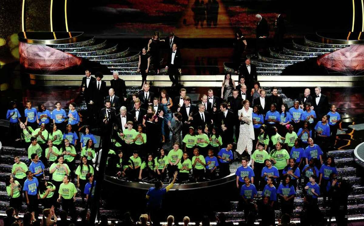 HOLLYWOOD, CA - FEBRUARY 27: The student choir from the New York City/Staten Island School PS 22 performs as the Oscar winners are seen onstage during the 83rd Annual Academy Awards held at the Kodak Theatre on February 27, 2011 in Hollywood, California. (Photo by Kevin Winter/Getty Images)